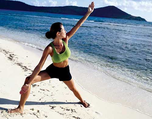 Woman Exercising on the Beach Woman Exercising on the Beach