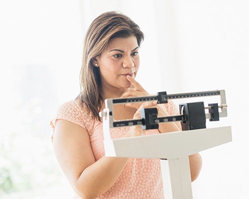 woman weighing herself