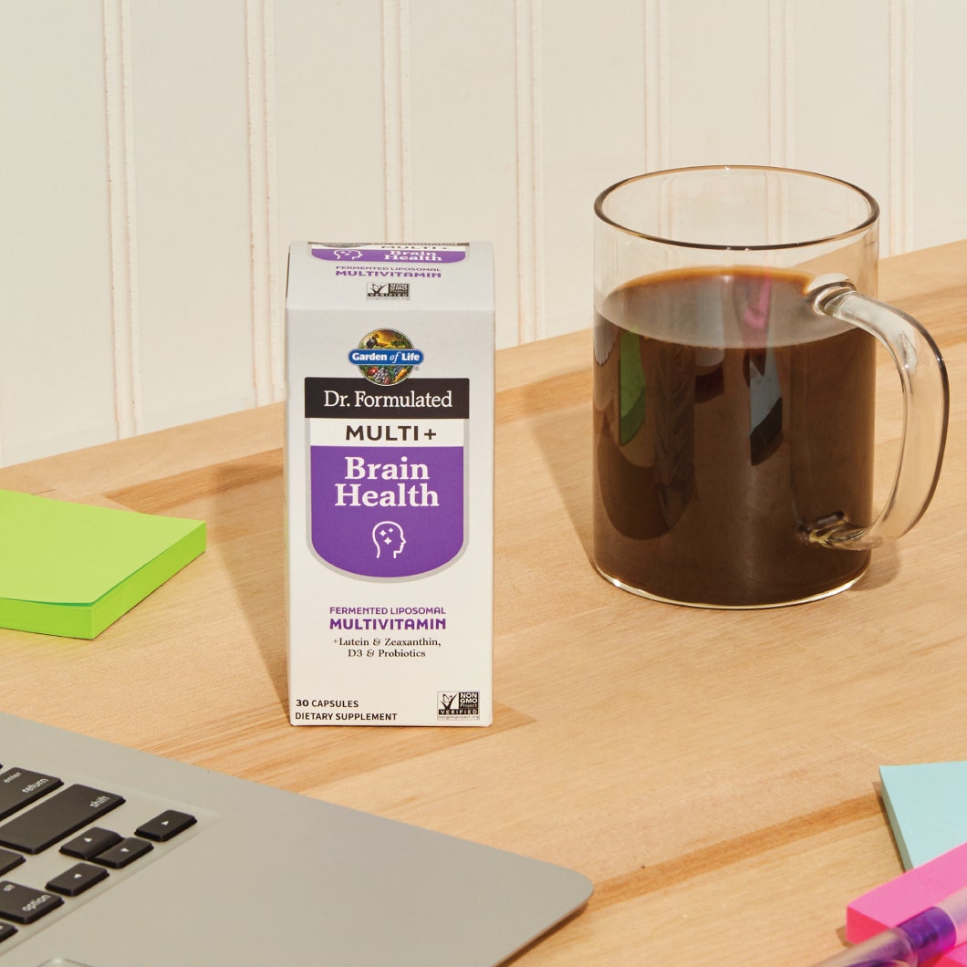 Dr. Formulated Multi Plus Brain Health next to a cup of coffee