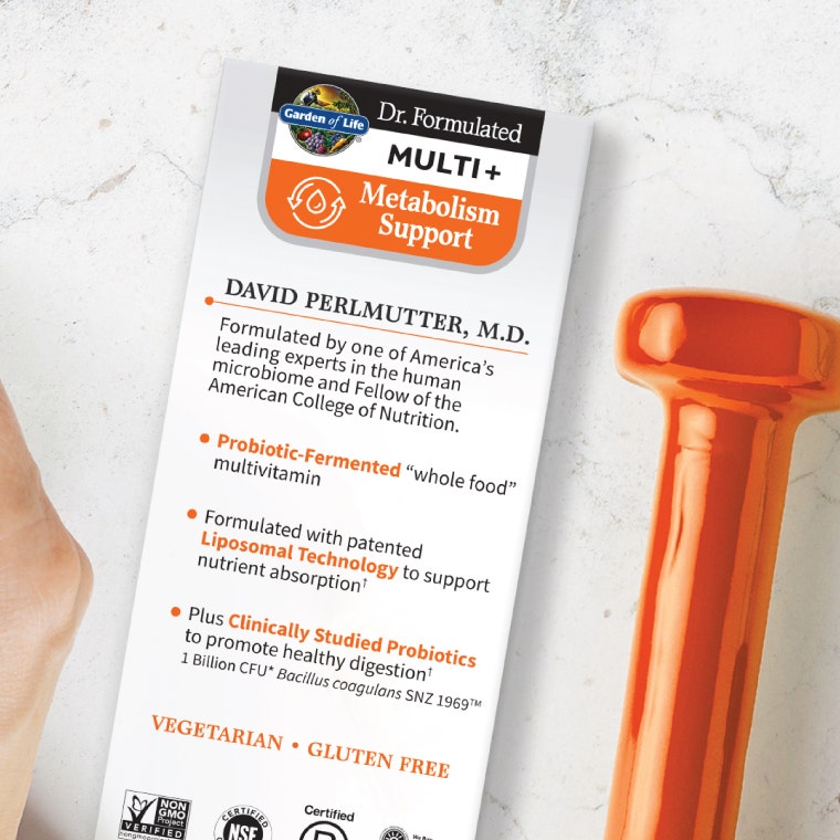 Dr. Formulated Multi Plus Metabolism Support next to a dumbbell