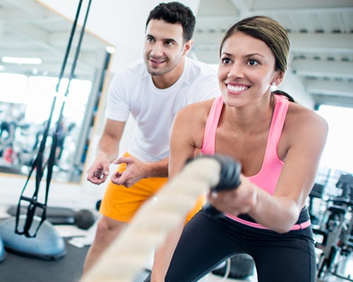 Woman working out with ropes