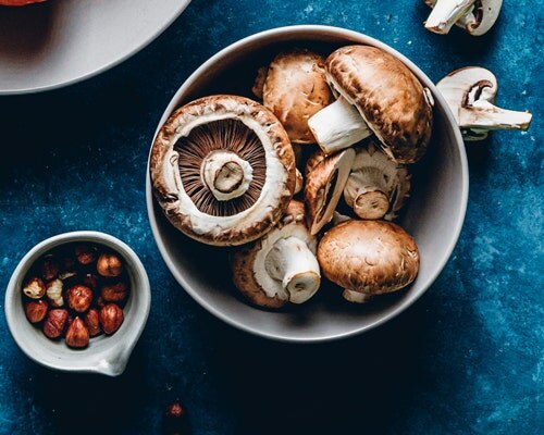 mushrooms and nuts in a bowl Zinc Benefits