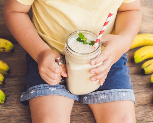 kid with smoothie and straw